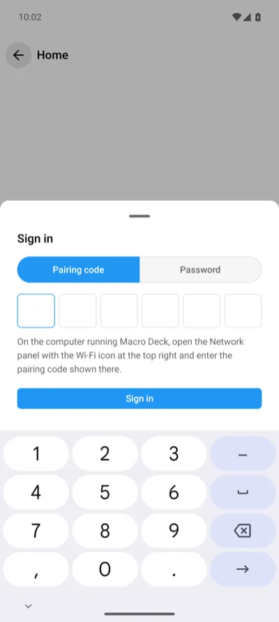 The sign-in sheet in the Android app, with the pairing code boxes and the hint where to find the code
