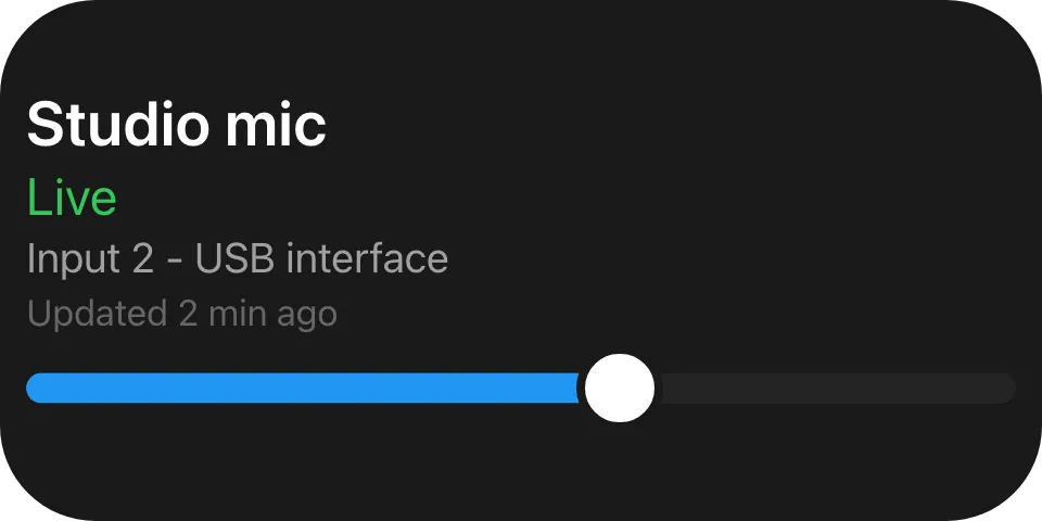 A dark tile: Studio mic in white, Live in green, two lines of grey detail and a blue slider